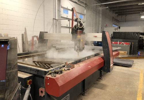 water jet cutting through metal