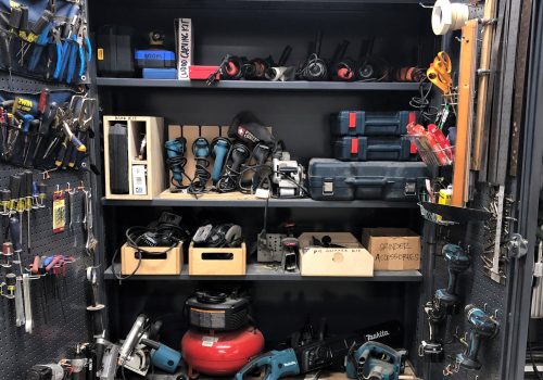 wood shop cabinet holding hand-held tools such as screwdrivers